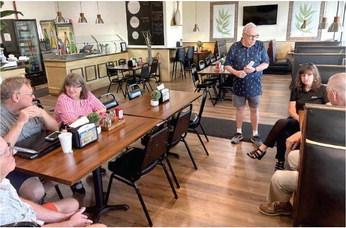Bill Dalton of the Southport Connector Alternative Routes group meets with community members and business owners at Boriquen Restaurant last week. PHOTO/ASHLEY GUSS