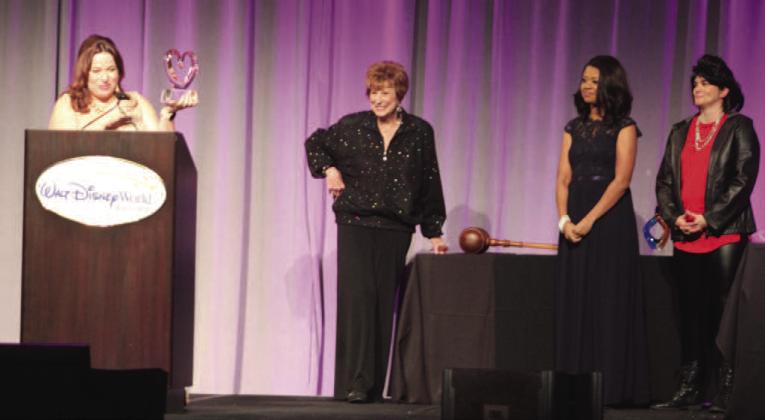Hope Partnership's Mary Downey accepts the Linda Goodwin-Nichols Service Award (with its namesake to her right) for her extensive record of engagement in the Osceola community. PHOTO/KEN JACKSON