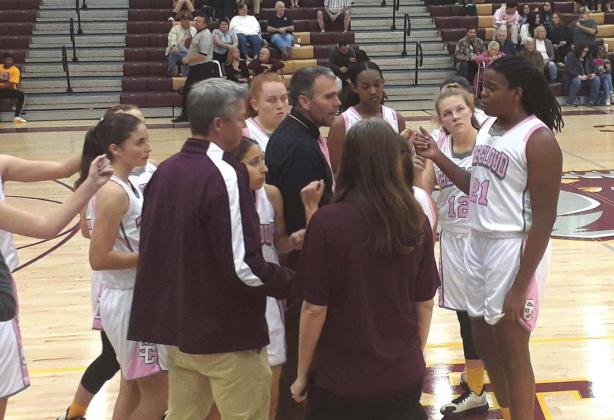 St. Cloud Head Coach Chad Ansbaugh instructs his team during a timeout. The Lady Bulldogs would go on to a 38-point win over Celebration. NEWS-GAZETTE PHOTO/J. DANIEL PEARSON