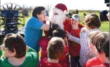 FILE PHOTO Each year, Dave Johnson arrives at the Boggy Creek Resort and RV Park by airboat to give toys to atypical children of the Russell Home.