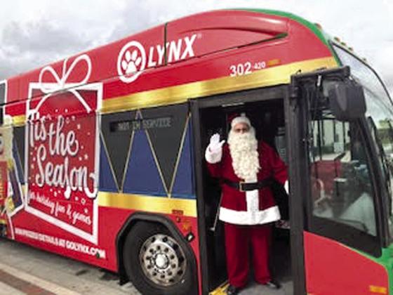 Santa — a.k.a. LYNX bus driver Edwin Cartagena — made some riders’ day. Those who rode on his Saturday routes through Kissimmee got a free ride. PHOTO/DAVID CHIVERS