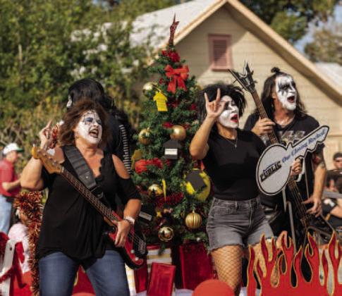 Only thing this KISS tribute group lacked in the parade was some misletoe — see what we did there?