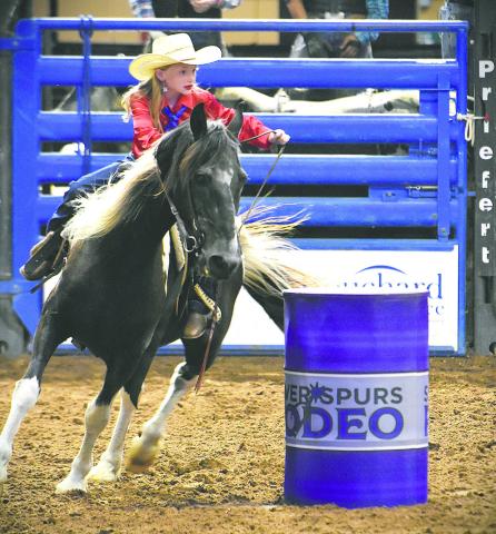 Barrel racer Della Strickland, fresh off competing in Thursday’s Little Miss Silver Spurs pageant, took to the Silver Spurs Arena dirt with her horse to compete. (Photo/Katie Williams)
