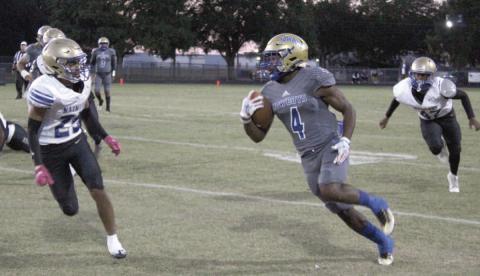 Osceola running back Taevion Swint runs for hard yardage in Friday’s 33-6 win over Mainland. The Kowboys can claim another district championship this Friday when they host Tohopekaliga. PHOTO/KEN JACKSON