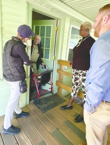 St. Cloud City Council members Jennifer Paul and Kolby Urban, along with Jo Ann Henry, deliver meals to St. Cloud’s elderly last week during the annual “Community Champion” event that raises awareness of the time, talent and treasure it takes to deliver client meals. PHOTO/DEBBIE DANIEL