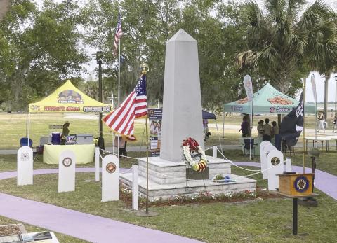 At the Osceola County war memorial, collocated with American Legion Post 10, “Taps” was performed by the Osceola County Veterans Council Honor Guard after firing a 21-gun salute. PHOTOS/TERRY LLOYD