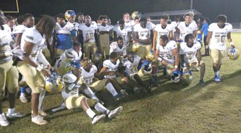 The Osceola Kowboys gather after their narrow 28-21 playoff win Friday over Newsome. PHOTO/DAN PEARSON 