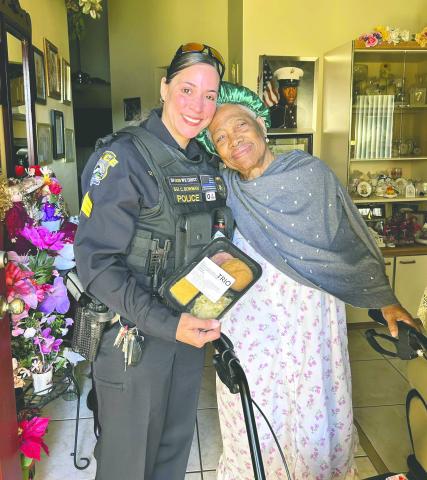 St. Cloud Police Sgt. C. Bowman delivers Meals on Wheels to Osceola County seniors during Community Champions Week on March 19. PHOTO/OSCEOLA COUNCIL ON AGING