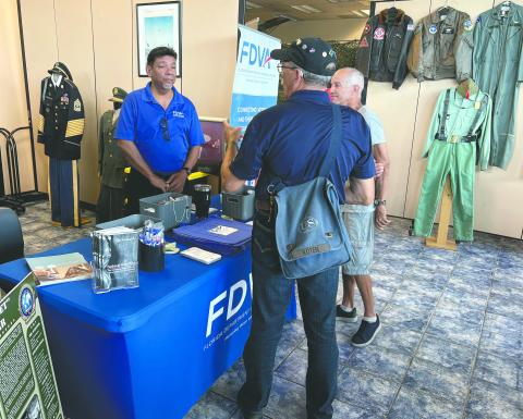 Israel Rodriguez of the Florida Department of Veterans Affairs discusses state benefits available to Florida resident veterans (Photo/Terry Lloyd).