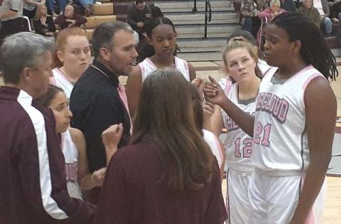 News-Gazette photo/J. Daniel Pearson. St. Cloud Head Coach Chad Ansbaugh instructs his team during a timeout.  The Lady Bulldogs would go on to a 38-point win over Celebration. 