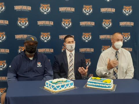 Assistant Football Coach Chris Biggz, left, and Assistant Coach Chris Johnson, right, introduce new head football coach Jeff Higgins on Wednesday afternoon. News-Gazette Photo/ J. Daniel Pearson