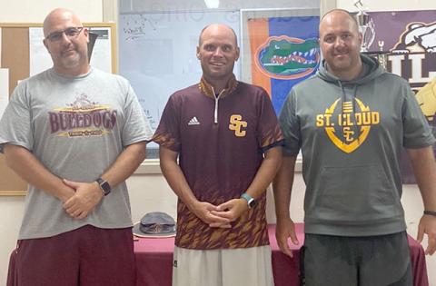 St. Cloud Defensive Coordinator Brandon Pennington (left), and Offensive Coordinator Mike Short (right) are former high school head coaches on Bryan Smart’s Bulldog staff. PHOTO / ST. CLOUD HIGH SCHOOL