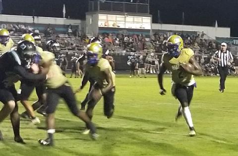 Osceola quarterback Chad Mascoe runs for a 3-yard touchdown in the Kowboys' 40-14 win over Olympia Friday. PHOTO/KEN JACKSON 