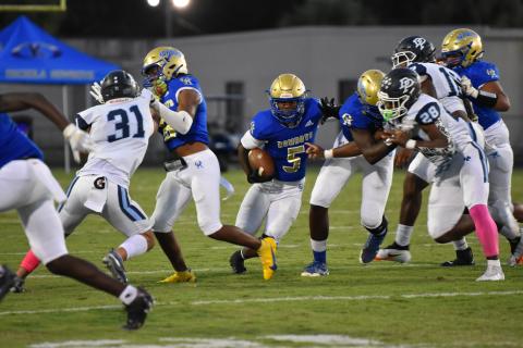 Ja'Randy Swint ran for a touchdown that gave Osceola a second-quarter lead over West Orange. The Warriors rallied for a 35-21 win, handing the Kowboys their first district loss since 2010. PHOTO/JANA STULTZ