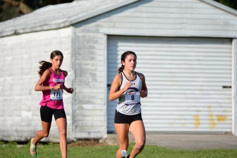Celebration's Catalina Edwards (right) and Harmony's Lailana Decker finished 3rd and 4th at the District 4A-5 cross country race. The teams qualified for Saturday's regional at Austin-Tindall Sports Complex at 7:30 a.m. PHOTO/DONALD LAMB