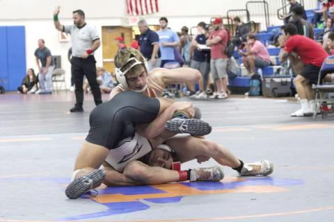 Harmony’s J.C. McNichols (top) will lead his Longhorn teammates into the FHSAA District Dual Championships on Saturday at Winter Springs. McNichols is undefeated and the top-ranked wrestler in Class 3A at 145 pounds. PHOTO/J. DANIEL PEARSON