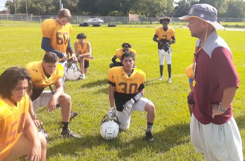 St. Cloud’s Bryan Smart, talking to his football team during summer 2021 workouts, will leave that post to become the Bulldogs’ athletic director. FILE PHOTO