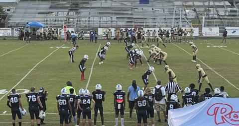 The Osceola Kowboys (right, in gold) line up to run a play against Rockledge Friday. QB David Buggs fired three long touchdown passes. 