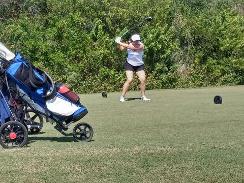 St. Cloud’s Tess Shieve tees off on number 18 at the FHSAA District 6 Championships.  After hitting her drive in the water, she would go on to make a sensational up-and-down par and shoot a career-low two-over 74 to help pace the Lady Bulldogs to a second place district finish and a trip to next week’s Class 3A, Region 2 Championship. PHOTO/J. DANIEL PEARSON