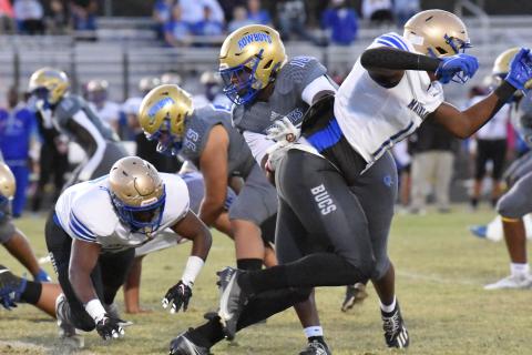 The Osceola defense, led by John Walker and Derrick LeBlanc, pictured here last week against Mainland, made life difficult for Tohopekaliga quarterback Sabby Meassick. PHOTO/JANA STULTZ 