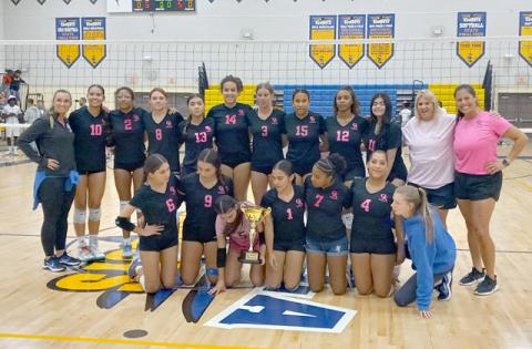 Osceola High with the OBC volleyball championship trophy after a three-set win over Tohopekaliga Thursday. PHOTO/DAN PEARSON