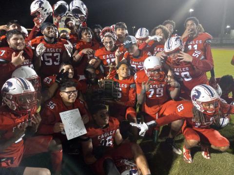 Poinciana players post with the Battle of the Boulevard trophy, taking the hardware home for the first time in school history.  (Photos by J. Daniel Pearson)