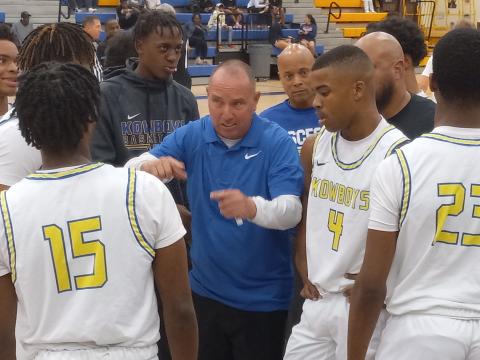 Osceola Coach Steve Mason talks strategy with his team during a third quarter timeout in Tuesday's win over Gateway. PHOTO/DAN PEARSON 