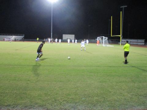Gateway’s Luis Rivero (black jersey) gets ready to take a free kick in the first half against Harmony.  The Panthers won the game 2-0 to advance to the title contest.  PHOTO/DAN PEARSON