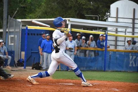 Nick Palmi (at bat) watches as he sends a first inning pitch over the right-center field wall for a home run in Osceola's 6-3 Class 7A regional baseball playoff win. PHOTO/CARRIE PALMI