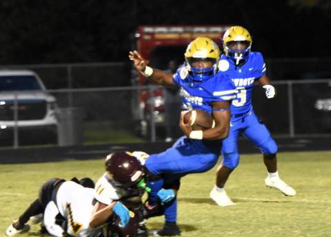 The St. Cloud defense slowed down Osceola's Taevion Swint at times, but not enough -- he scored four touchdowns in Friday's 49-3 win in "The Game". PHOTO/KATIE WILLIAMS
