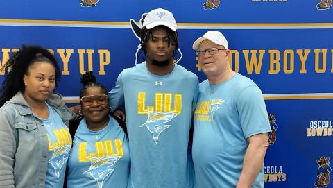 Osceola's Jalen Bell with his family at Friday's signing with FCS school Long Island. PHOTO/J. DANIEL PEARSON