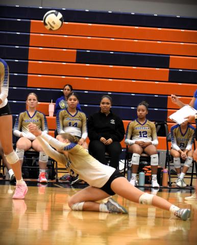 Osceola’s Mady Mailender goes to the floor to make a dig in Thursday’s OBC championship. PHOTO/KATIE WILLIAMS