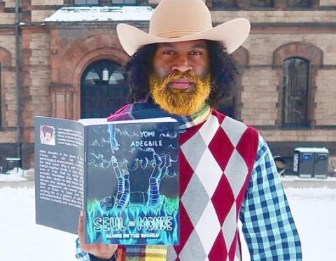 Ayomiku Adegbile with his first self published graphic novel: ‘Seul Au Monde’. PHOTO/KEA MORSHED