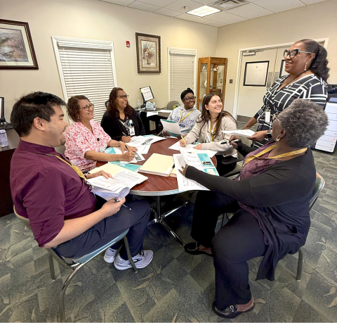 Dr. Johnola Morales, Chief of Staff and Senior Vice-President of Case Management and Home Care within the Osceola Council on Aging, meets with social work staff, and internship students from the University of Central Florida, and Barry University. PHOTO/OSCEOLA COUNCIL ON AGING