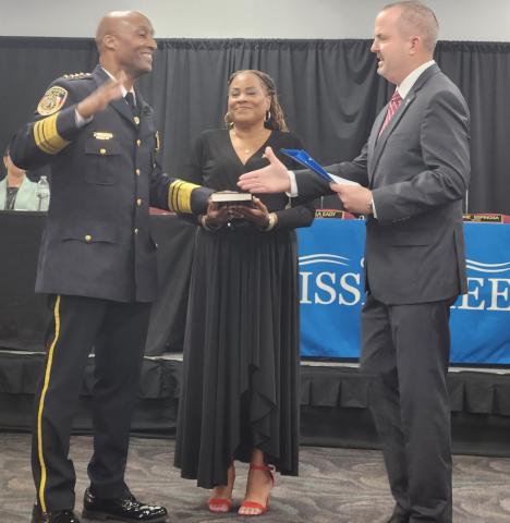 Orange County Deputy County Administrator of Public Safety Danny Banks swears in Charles Broadway Tuesday as Kissimmee's new Police Chief. PHOTO/KEN JACKSON