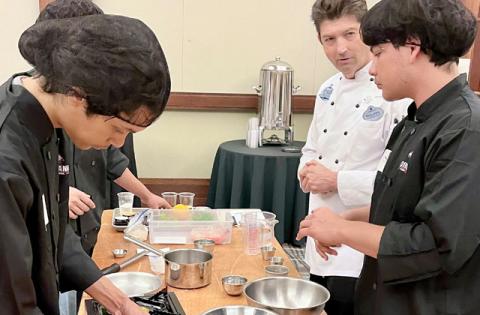 Students from Poinciana High School work with their chef mentor in the Mystery Meal competition, to demonstrate their skills in plate presentation as well as cooking. PHOTOS/DEBBIE DANIEL