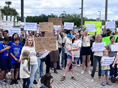 Parents protested before Tuesday’s Osceola County School Board meeting, opposing impending changes to the District’s Exceptional Student Education program model. PHOTO/DEBBIE DANIEL