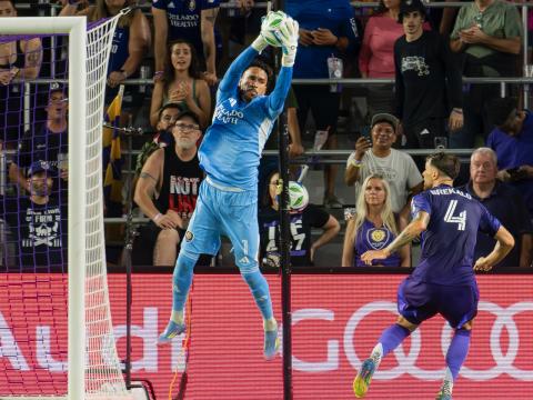Pedro Gallese saves a shot on goal as Orlando City defeated Portland, 1-0, on Saturday, with help from a defense that included David Brekalo (4). (Photo Mario Casamalhuapa)