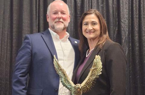 2025 Golden Eagle Award honoree, Osceola County Property Appraiser Katrina Scarborough, with event emcee Brian Wetzel of St. Cloud Hospital. (Photo/Ken Jackson)