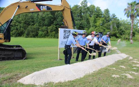 Current and future Station 32 staff participate in the groundbreaking for the newest fire department facility Friday. (Photo/Terry Lloyd)