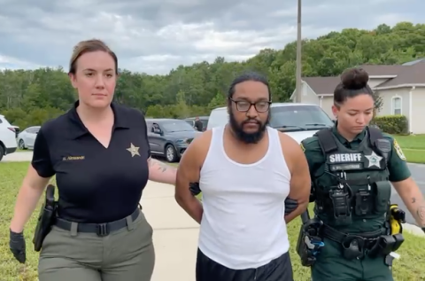 Ryan Darshanand Brijlal, who police say possessed and shared child sexual abuse material across social media, was arrested and led out of a Crescent Lakes home Tuesday morning. (Photo/Osceola County Sheriff's Office)