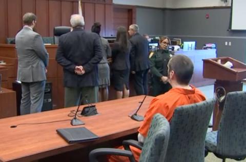 Stephan Sterns sits alone while the attorneys in the case confer with Judge Keith Carsten during Monday's plea hearing. Sterns pled guilty to 20 charges of sexual assault and lewd and lascivious molestation of Kissimmee's Madeline Soto. (Photo/Osceola County Courthouse)