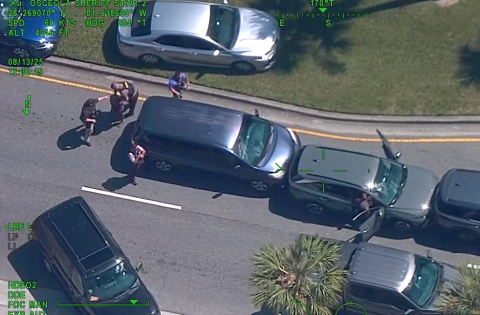 Osceola County Sheriff's deputies take down a pair of suspected car burglars — and are about to discover a two-year-old in the back seat — in ChampionsGate Wednesday. (Photo/Osceola County Sheriff's Office)