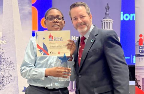 Ara Afolabi of Voyager K-8 School in St. Cloud (with Osceola Chamber President John Newstreet) finished in third place in Friday’s National Civics Bee regional competition at the Rosen Centre. 