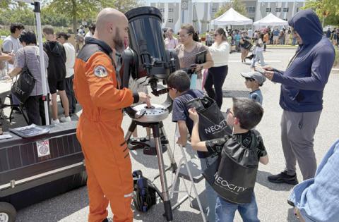 Who doesn’t love driving a remote control robot, or check out the heavens in a really big telescope? Both were on display Saturday at the NeoCity STEM Day. (Photos/Terry Lloyd)