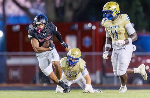 Osceola defenders Jason Lewis (11) and Colton Carter (21) try to bring down Gateway’s Honor Kim in Friday’s spring football jamboree. (Photo/Taylor McFee)