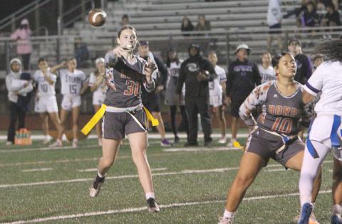 Harmony quarterback Ivy Munns, shown in the OBC title game — another Harmony come-from-behind win — tossed three touchdown passes to help the Longhorns rally to a 26-20 win Monday over Palm Beach Gardens in the 3A regional semifinals. (Photo/Michelle Kostuch)