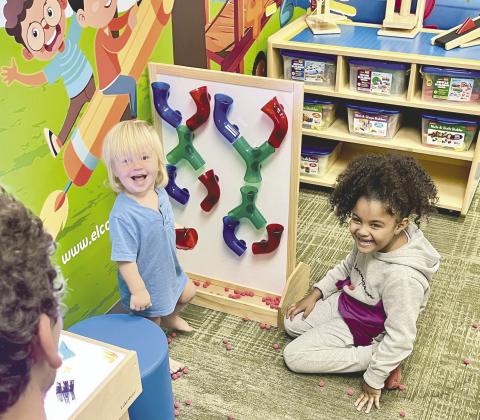 Future engineers develop their skills in the new Early LearnHub center which focuses on literacy, sensory, and motor skills Monday at the Hart Memorial Library in downtown Kissimmee. PHOTO/DEBBIE DANIEL