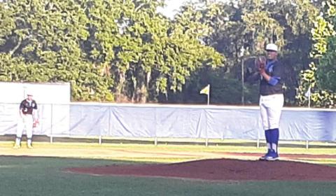 Osceola’s Shawn Lara gets ready to deliver the first pitch of the game in the Class 7A, District 9 NEWS-GAZETTE PHOTO/J. DANIEL PEARSON