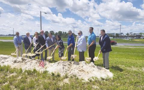 Kissimmee Place Development Group principals joined city leaders and legislators on the Hyatt Studios hotel project across Martin Luther King Boulevard from the Kissimmee Gateway Airport. (Photo/ Ken Jackson)